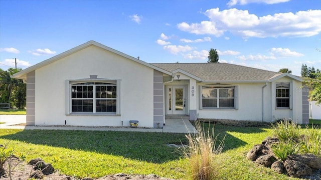 ranch-style home featuring a front yard