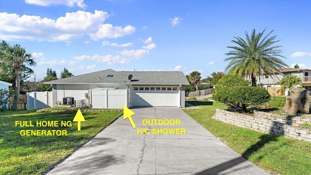 view of front of property with a front lawn and a garage