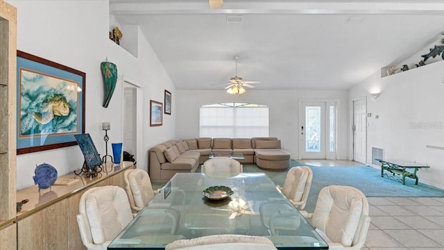 tiled dining space with vaulted ceiling with beams and ceiling fan