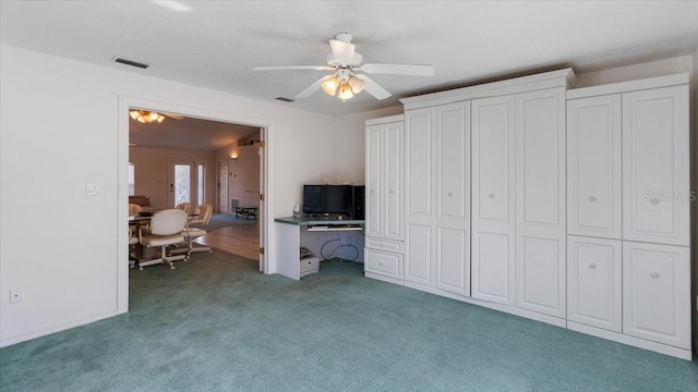 unfurnished bedroom featuring light colored carpet and ceiling fan