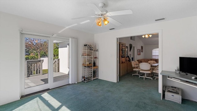 interior space with ceiling fan and dark colored carpet