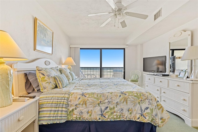 bedroom with carpet, ceiling fan, and access to outside