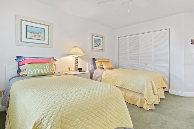 bedroom with a closet, carpet flooring, and ceiling fan