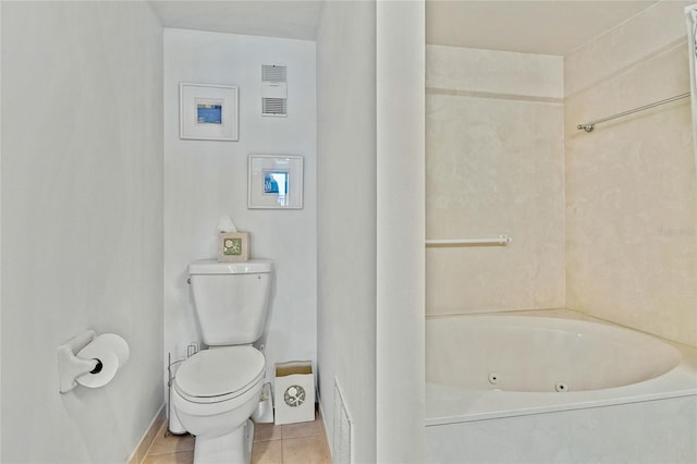 bathroom featuring toilet and tile floors