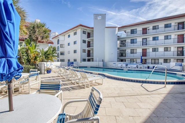 view of swimming pool featuring a patio area