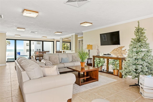 tiled living room featuring a textured ceiling, a wealth of natural light, and ornamental molding