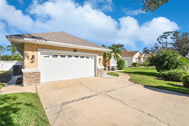 single story home featuring a front yard and a garage