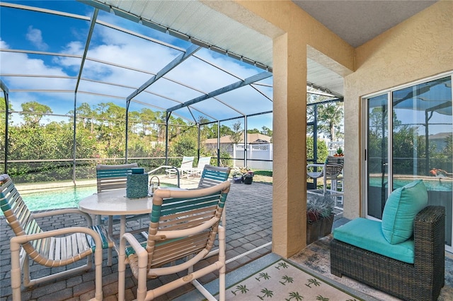 sunroom / solarium featuring lofted ceiling and a wealth of natural light