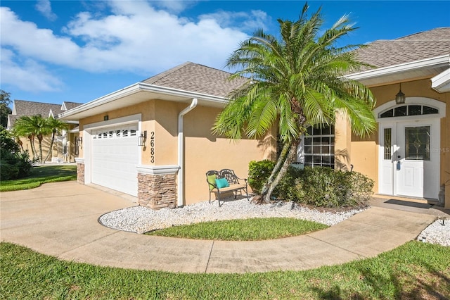 view of front of house with french doors and a garage