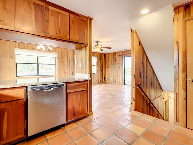 kitchen featuring light tile floors, stainless steel dishwasher, and ceiling fan