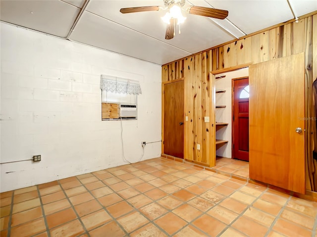 tiled empty room with ceiling fan