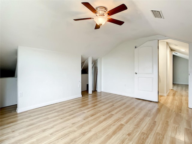 bonus room featuring vaulted ceiling, light hardwood / wood-style floors, and ceiling fan