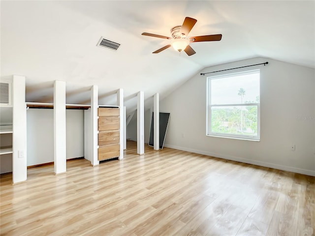 additional living space with lofted ceiling, light hardwood / wood-style floors, and ceiling fan