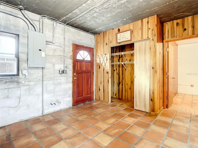 foyer entrance with light tile floors and a healthy amount of sunlight