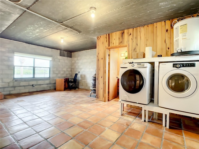 laundry area with light tile floors, electric water heater, and independent washer and dryer