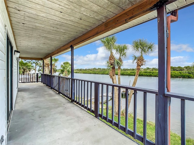 view of terrace featuring a balcony and a water view