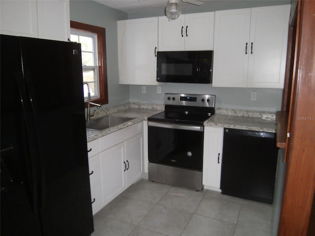 kitchen with white cabinetry, ceiling fan, black appliances, sink, and light tile floors