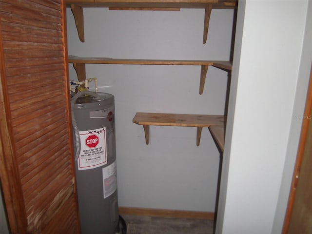 utility room with electric water heater