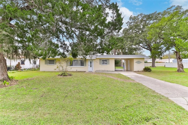 single story home featuring a carport and a front yard