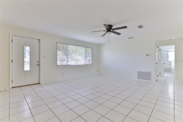 foyer with light tile floors and ceiling fan