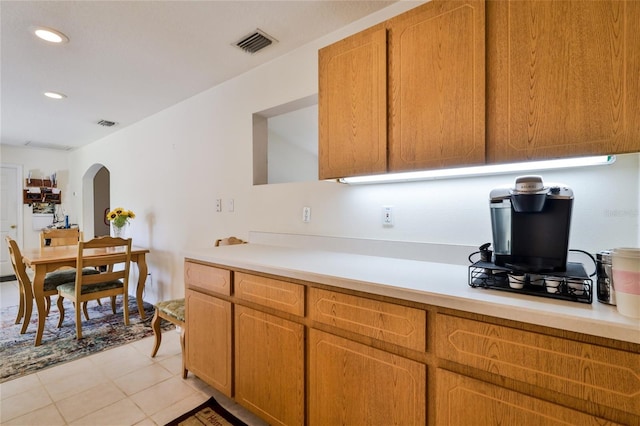 kitchen featuring light tile floors