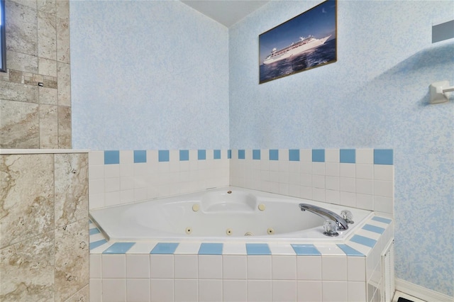 bathroom with tiled bath