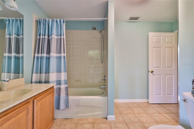 full bathroom featuring vanity, tile floors, shower / bathtub combination with curtain, a textured ceiling, and toilet