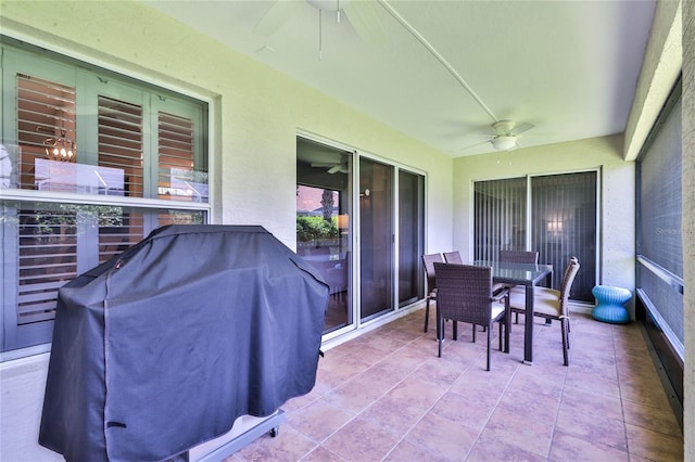 view of terrace with a grill and ceiling fan