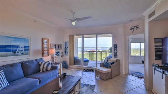 263 Minorca Beach Way Unit 803, New Smyrna Beach, FL 32169 - tiled living room featuring a water view, ornamental molding, and ceiling fan