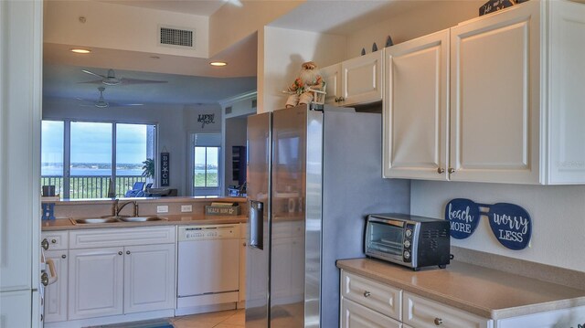 263 Minorca Beach Way Unit 803, New Smyrna Beach, FL 32169 - kitchen featuring white dishwasher, ceiling fan, white cabinetry, and sink