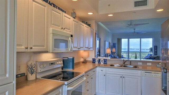 263 Minorca Beach Way Unit 803, New Smyrna Beach, FL 32169 - kitchen with white appliances, white cabinetry, ceiling fan, and sink