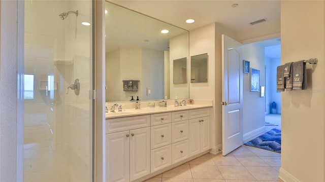 263 Minorca Beach Way Unit 803, New Smyrna Beach, FL 32169 - bathroom featuring a shower with door, tile floors, double sink, and large vanity