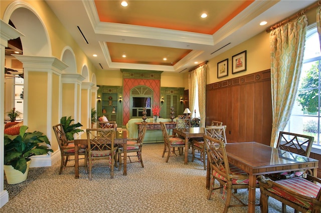 263 Minorca Beach Way Unit 803, New Smyrna Beach, FL 32169 - carpeted dining space with crown molding, a tray ceiling, and ornate columns