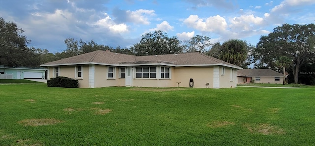 exterior space featuring a yard and a garage