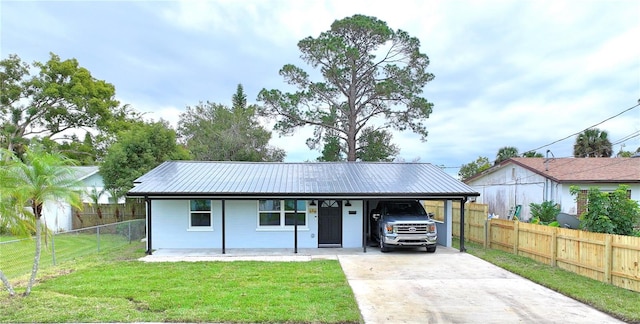 ranch-style home featuring a front lawn, a porch, and a carport