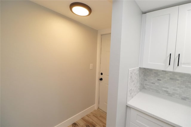 laundry room featuring light hardwood / wood-style floors