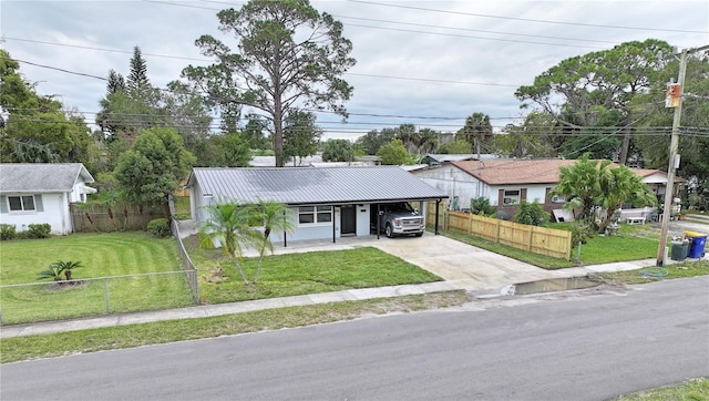 ranch-style house featuring a front yard and a carport