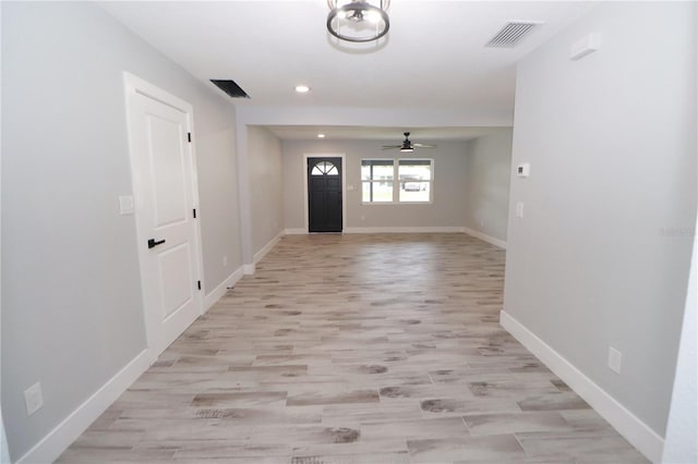 interior space with ceiling fan and light wood-type flooring