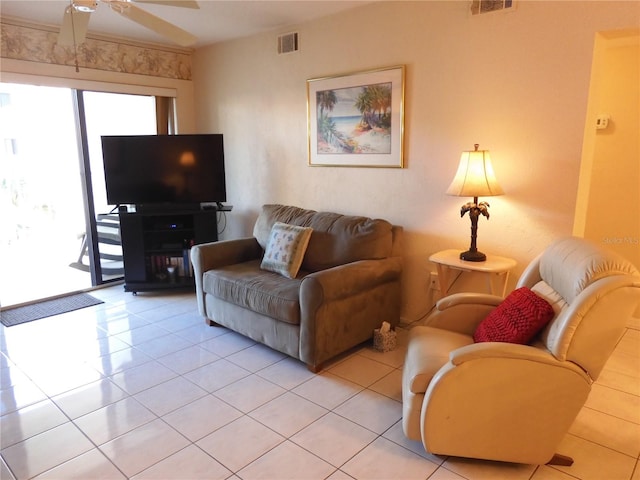 tiled living room with ceiling fan