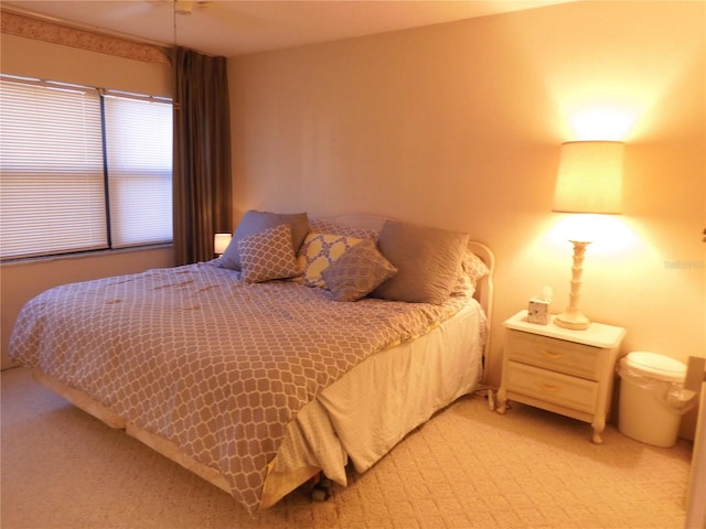 bedroom featuring light colored carpet