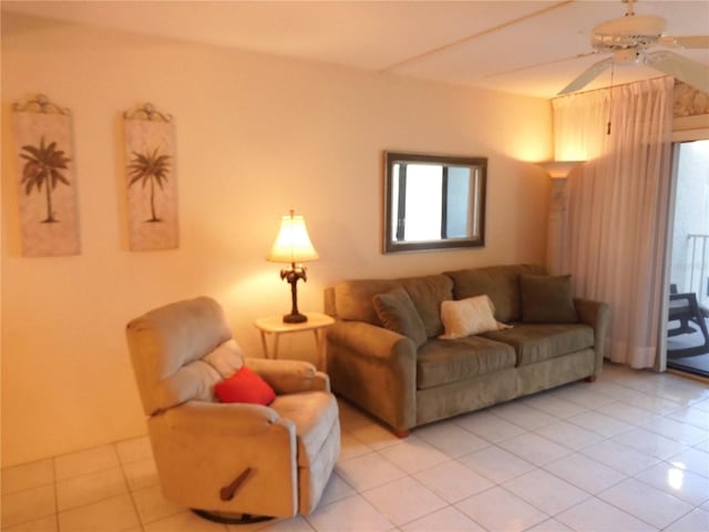 tiled living room with ceiling fan