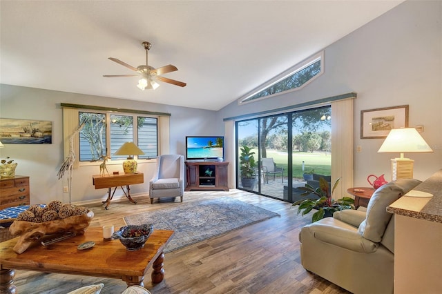 living room featuring lofted ceiling, plenty of natural light, hardwood / wood-style floors, and ceiling fan