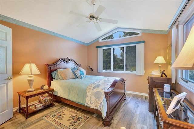 bedroom featuring vaulted ceiling, wood-type flooring, and ceiling fan