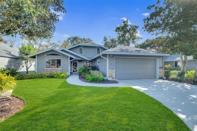 view of front of house with a front yard and a garage