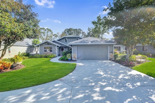 view of front of home with a front lawn and a garage