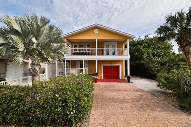 view of front of house with a balcony and a garage