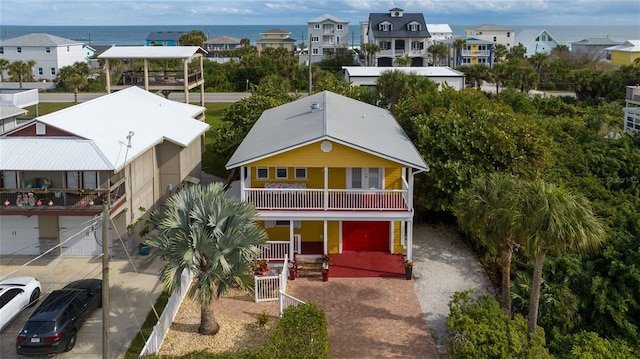 view of front of house with a balcony and a gazebo