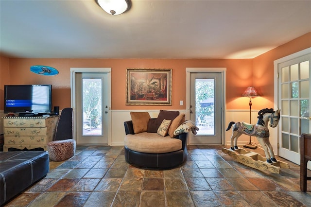 living room featuring dark tile floors