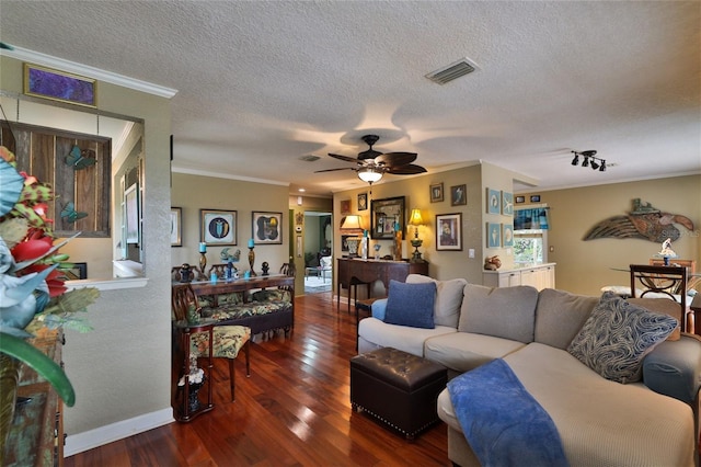 living room with a textured ceiling, crown molding, ceiling fan, and dark hardwood / wood-style flooring