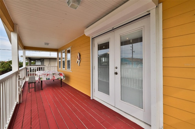 wooden deck featuring french doors